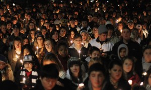 Penn State students and supporters hold a vigil for victims of child abuse in November 2011. Nearly 1 in 8 children will experience child maltreatment in their lifetime, a new study finds